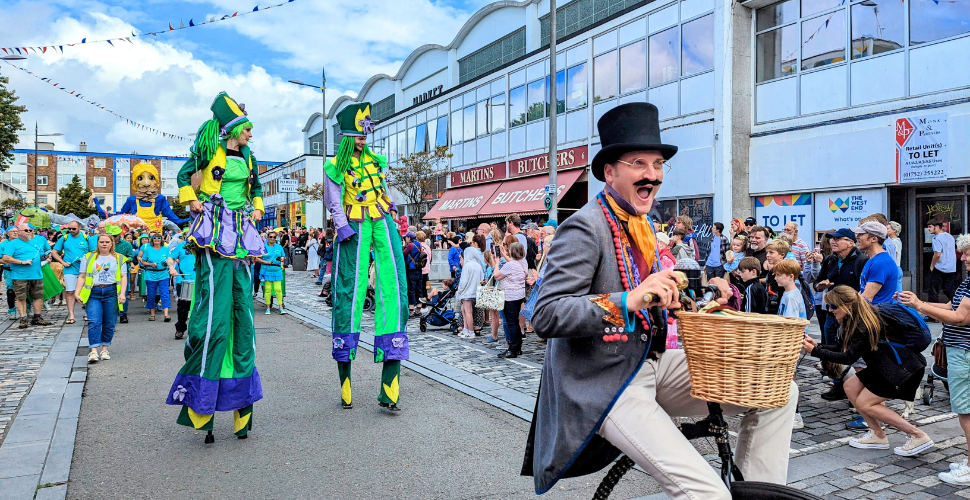 West End Carnival Parade with a unicycle in front 